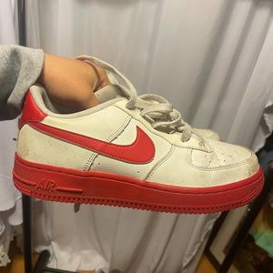 Red and white Nike youth 5.5, women’s 7/7.5